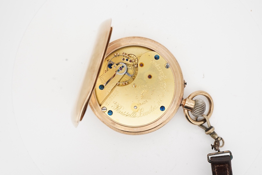 A George V 9ct gold hunter keyless lever pocket watch, by Russells Ltd of Liverpool, with Roman dial and subsidiary seconds, case diameter 48mm, gross weight 89 grams, with a leather suspension strap with rolled gold T-b